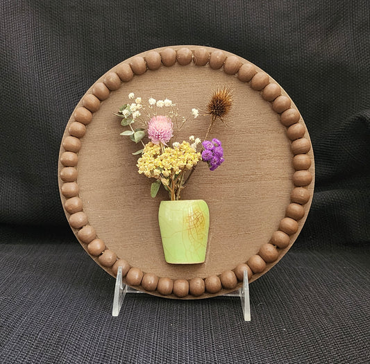 Small board with pottery and dried flowers