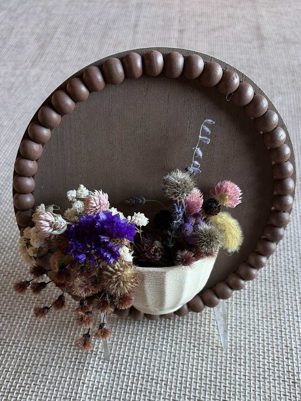 Small board with pottery and dried flowers