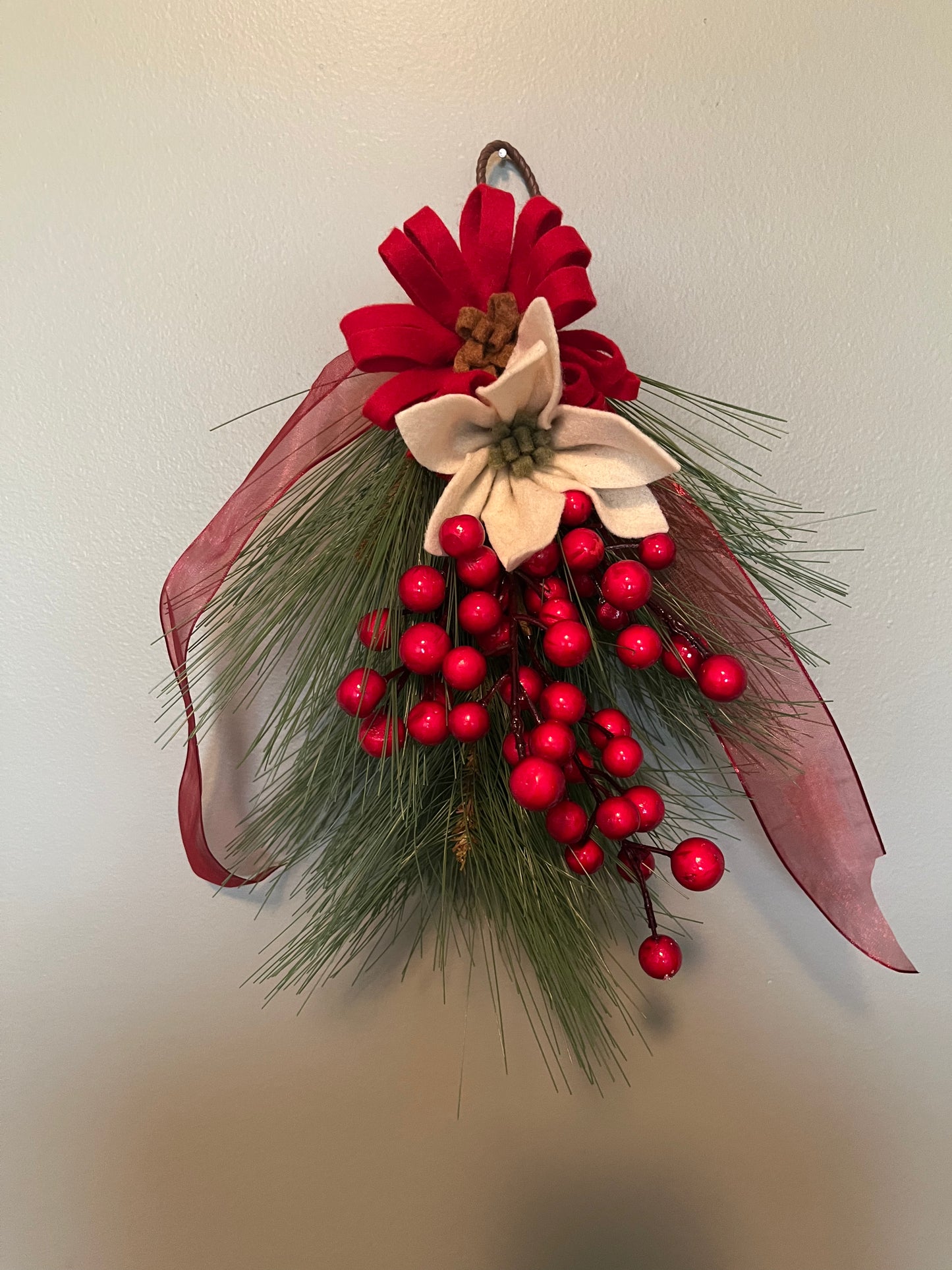 Greenery bough with felt flowers